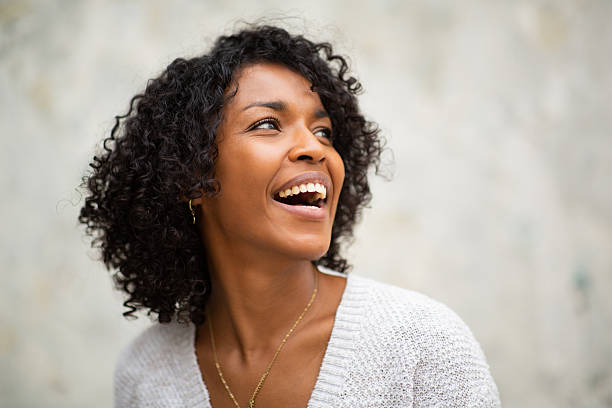 close up portrait happy young woman with curly hair